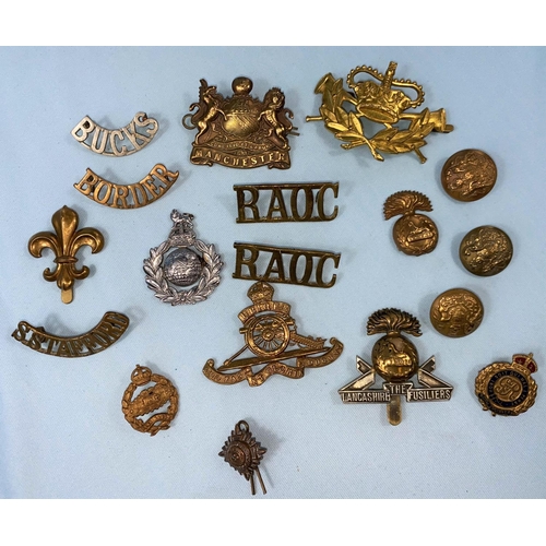 220 - A Manchester Regiment cap badge, another Lancashire Fusilier; various other items