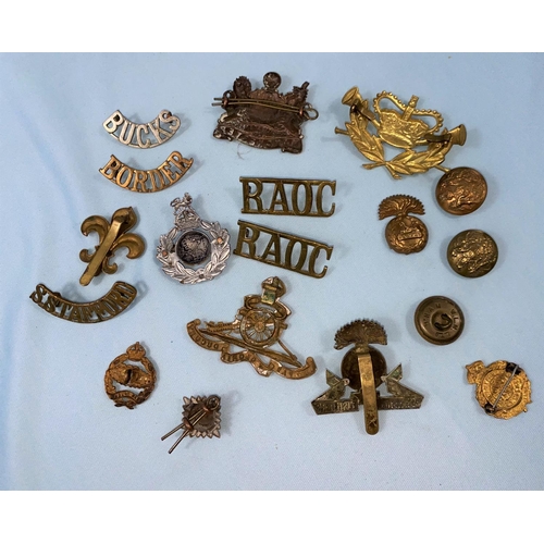 220 - A Manchester Regiment cap badge, another Lancashire Fusilier; various other items