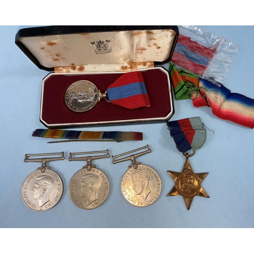 222 - 4 WWII war medals, a QEII Imperial Service medal awarded to Thomas Williamson, etc