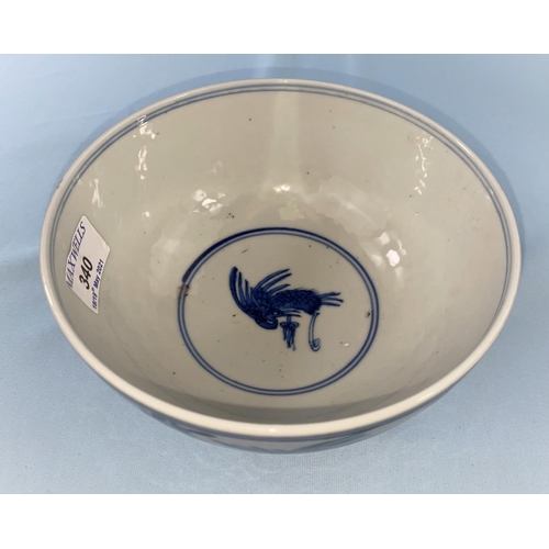 340 - A Chinese blue and white bowl decorated with birds in flight a leaf mark to base diameter 17cm