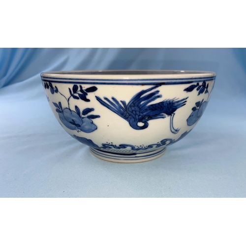 340 - A Chinese blue and white bowl decorated with birds in flight a leaf mark to base diameter 17cm