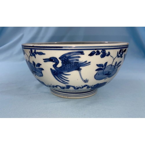 340 - A Chinese blue and white bowl decorated with birds in flight a leaf mark to base diameter 17cm