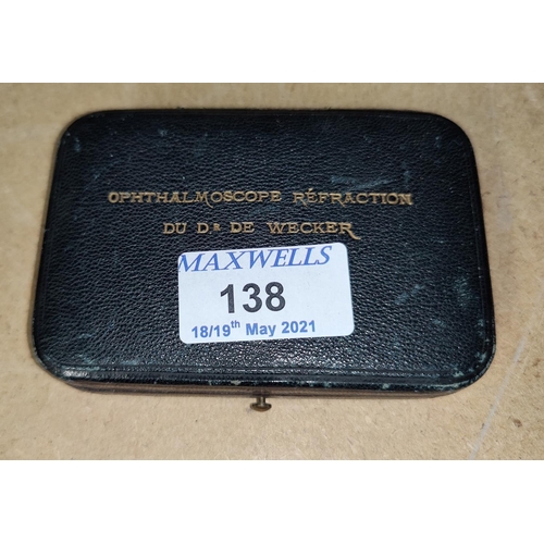 138 - A vintage cased opthalmoscope refraction set by Dv Dr De Wercker and a magnifying glass unmounted