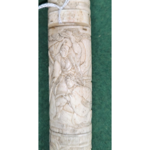 151 - A Japanese dagger in carved sectional case with figured decoration