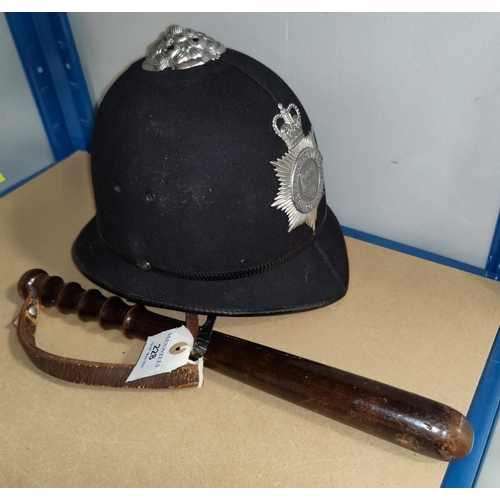 228 - A British Transport Police helmet, a hardwood truncheon