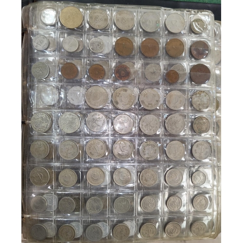 249 - A collection of world coins in albums, over 1000 examples from Panama, Peru, US, Russia etc