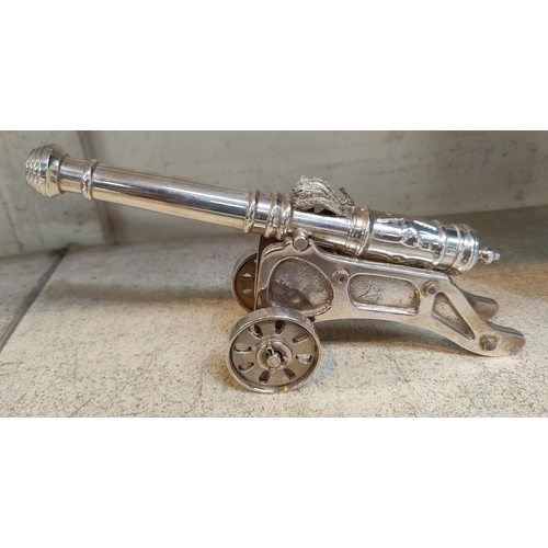 410 - A small silver plated cannon