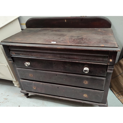 583 - A Victorian stained pine chest of 3 long drawers