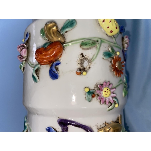 334 - A large Chinese beaker vase with areas of relief and raised decoration on a white background having ... 