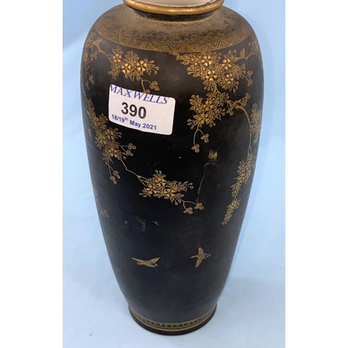 390 - A meiji period Japanese Satsuma vase with fine gilt decorations of trees and birds on a black backgr... 