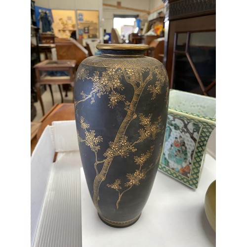 390 - A meiji period Japanese Satsuma vase with fine gilt decorations of trees and birds on a black backgr... 