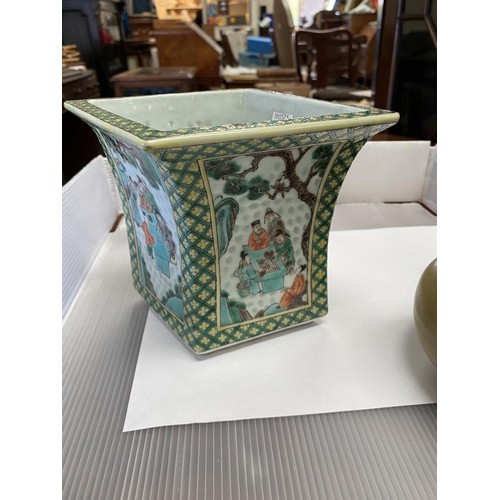 390B - A Chinese Famille Vert flattened squared vase with four panels of decoration with people playing or ... 