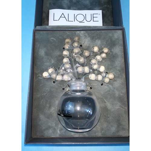 387 - An originally boxed modern Lalique scent bottle in the form of a vase with flowers on stems for lid,... 