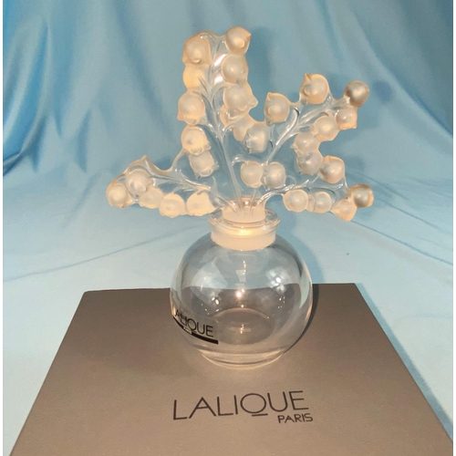 387 - An originally boxed modern Lalique scent bottle in the form of a vase with flowers on stems for lid,... 