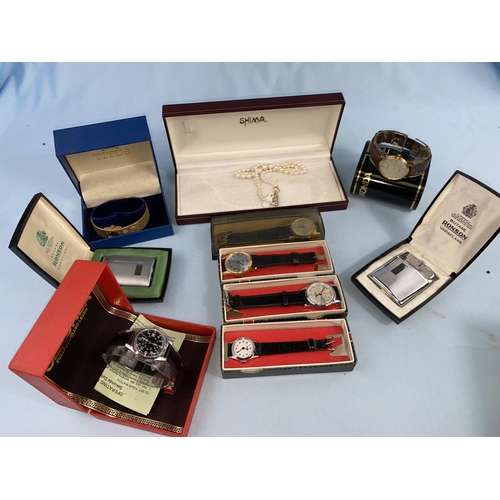 452 - Seven unused wristwatches in original boxes; 2 unused Ronson lighters in original boxes; a simulated... 