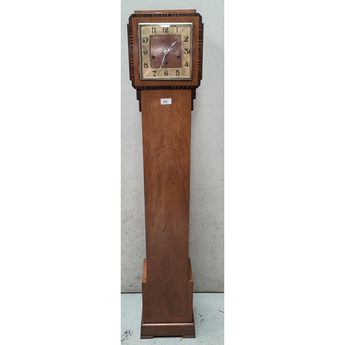 554 - An art deco granddaughter clock with inlay around the face, with chiming movement. Height: 140cm