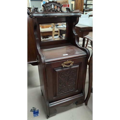 566 - An Edwardian carved mahogany fall front coal box with mirror and shelf over