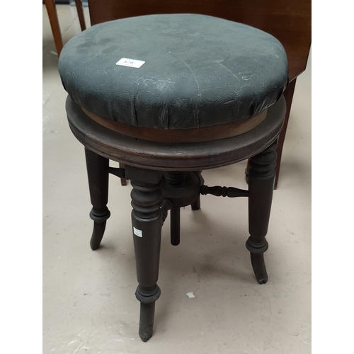 579 - A Victorian piano stools with revolving seats