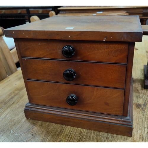 585 - Two Victorian revolving piano stools; a mahogany miniature 3 height chest of drawers one stool a.f