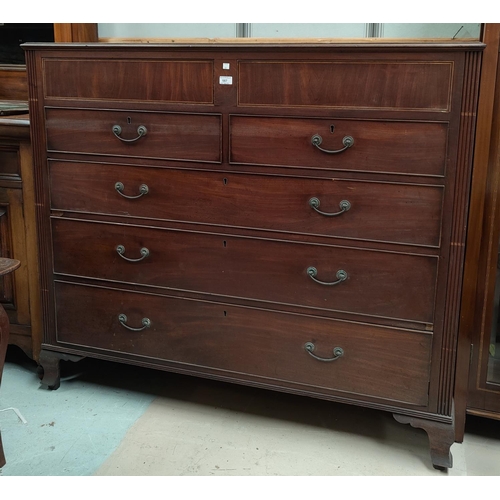 587 - A Georgian inlaid mahogany chest of 3 long, 2 short and 2 concealed frieze drawers, on ogee feet, wi... 