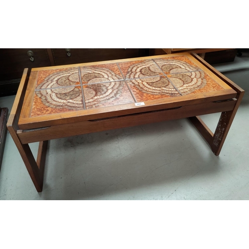 602 - A 1960's teak coffee table with tile top