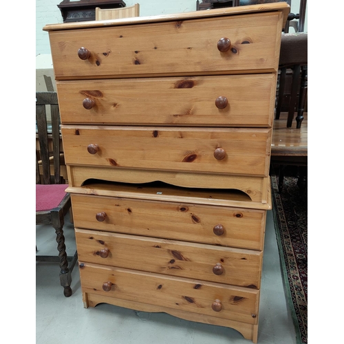 610 - A modern pine pair of 3 height chests of drawers