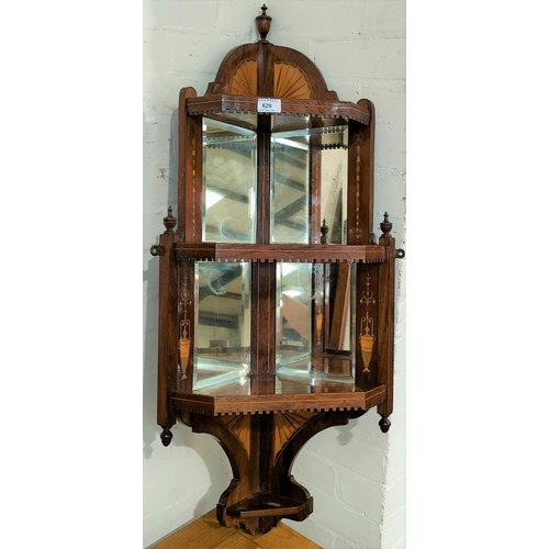 629 - An Edwardian rosewood 3 height corner whatnot in inlaid rosewood with mirror back, wall hanging, in ... 