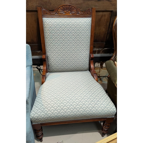 642 - An Edwardian carved walnut chair with low seat, blue patterned upholstery