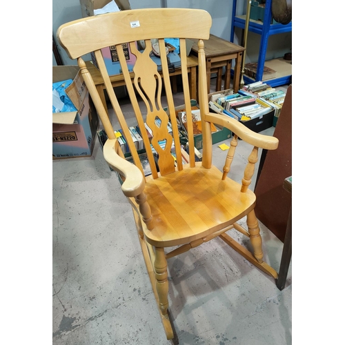 644 - A modern lightwood fiddleback rocking chair