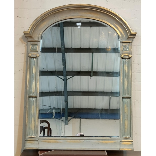 649 - An arch top mirror in silvered finish frame