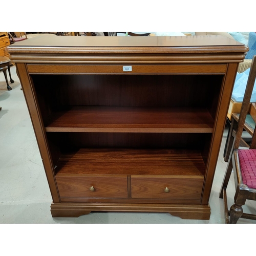 663 - A reproduction bookcase with 2 drawers under