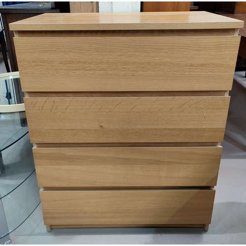 676 - A modern light oak 4 height chest of drawers