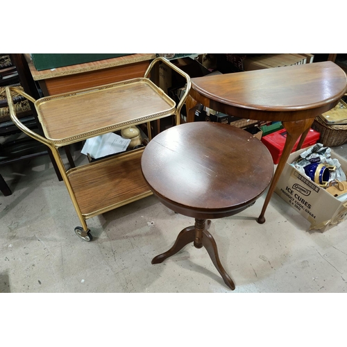 711 - A vintage gilt drinks trolley, a demi-lune table and circular occasional table