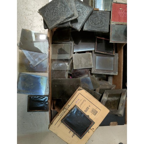 127B - A large selection of negatives on glass, items used with antique cameras
