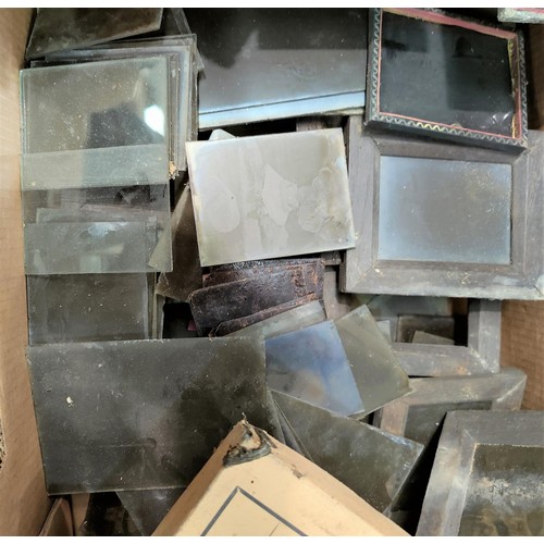 127B - A large selection of negatives on glass, items used with antique cameras