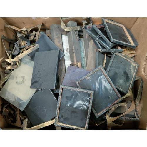127B - A large selection of negatives on glass, items used with antique cameras