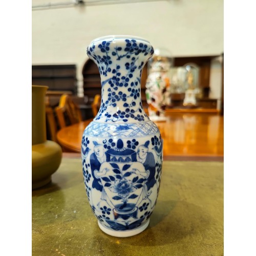 388 - A Chinese blue and white baluster vase decorated with two men holding a large vase, four character m... 