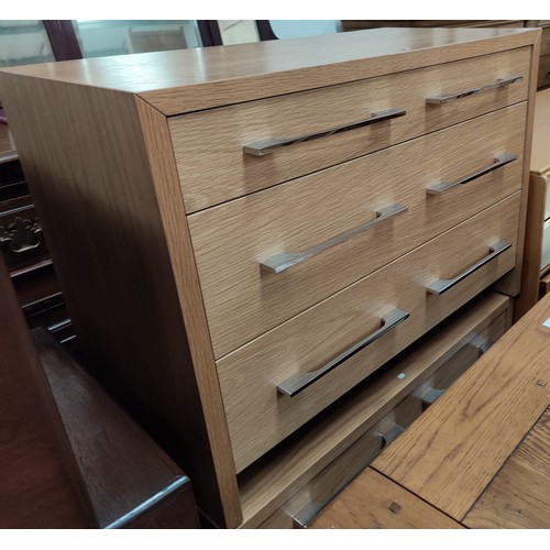 693 - A pair of modern 3 height oak chest of drawers