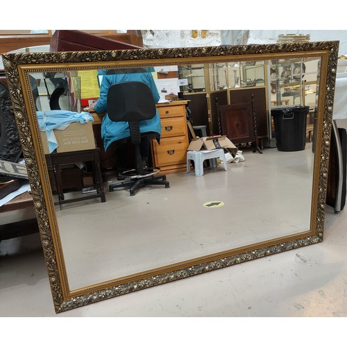 661 - A large rectangular wall mirror in gilt frame