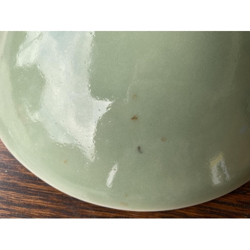 440 - A Chinese celadon glaze dish with incised floral decoration to the interior, diam 22.5cm (3 minor ch... 