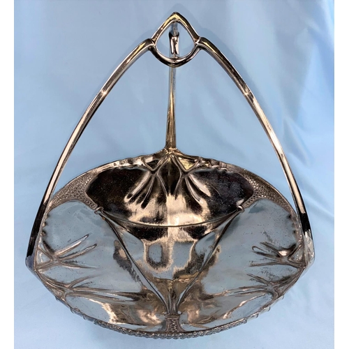 497 - A silvered pewter Art Nouveau cake dish with triform handle, stamped Urania, height 22 cm  The plati... 