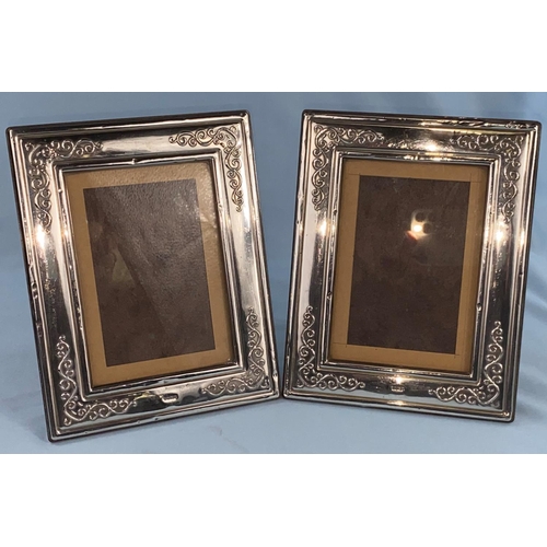516 - A pair of hallmarked silver surround photo frames, 18 x 14cm, Sheffield 1988