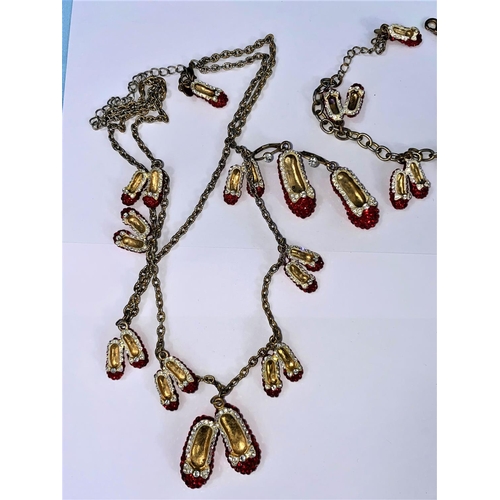 533 - A Butler and Wilson 'Red Shoes' necklace, bracelet and earrings; a Butler & Wilson multi colour ston... 