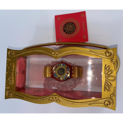538 - A Christian La Croix Christmas Swatch Watch in original case with box and bag