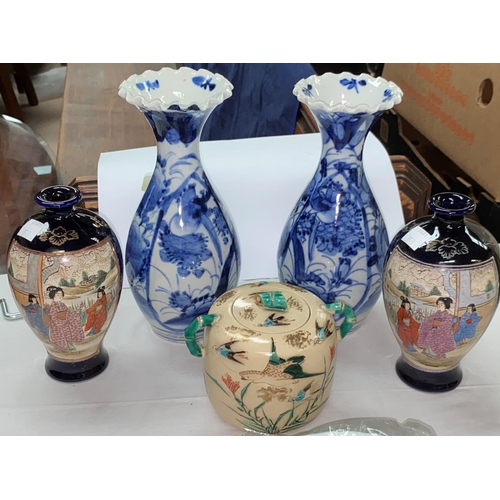 353 - A Japanese pair of Imari vases, 21 cm; a pair of satsuma vases, 15 cm; another piece