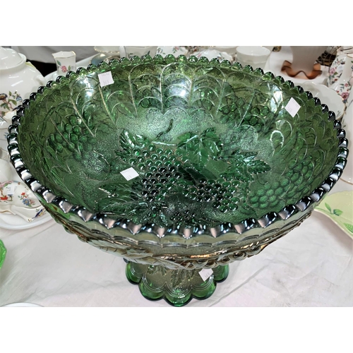 369 - An impressive Carnival Glass table centre green fruit bowl, molded fruiting vine decoration, diamete... 