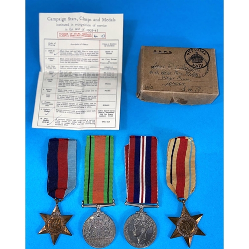 93 - A WWII group of 4 medals including The African Star with medal slip in box to Lieutenant R.T.Jackson