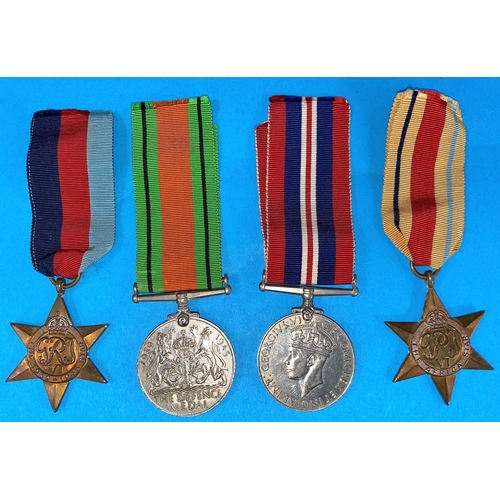 93 - A WWII group of 4 medals including The African Star with medal slip in box to Lieutenant R.T.Jackson