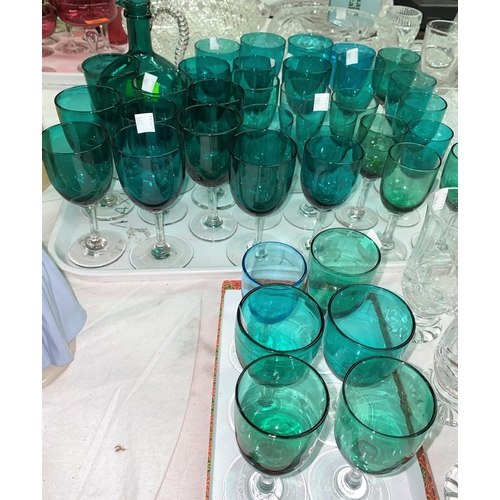 385 - A Victorian turquoise glass wine jug; 35 approx similar wines