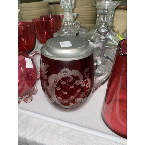 392 - Two decanters; cranberry and other coloured glassware
